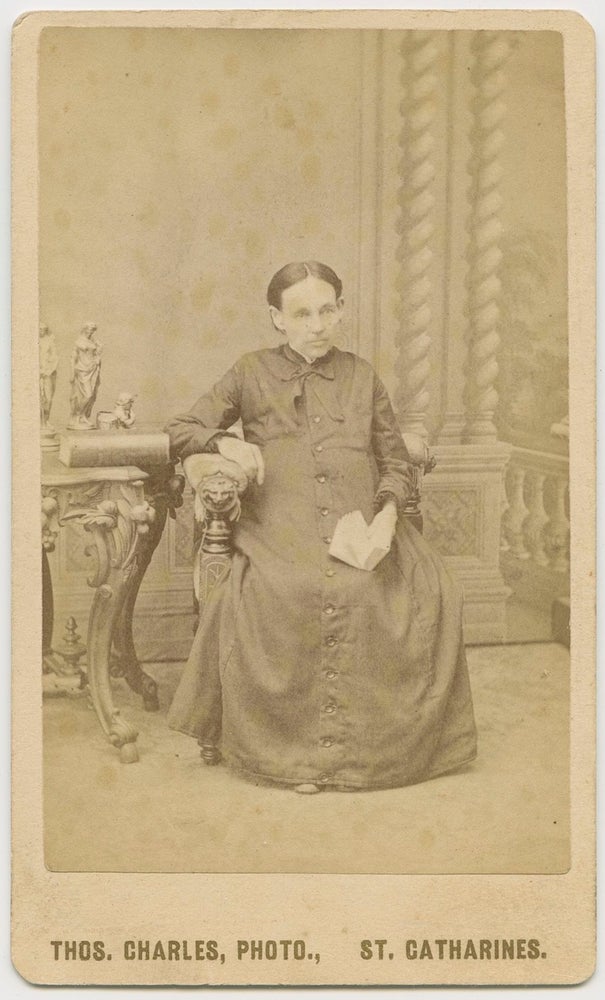 Item #2864 CDV, Older Woman ”Annie” seated taken by Thos. Charles, St. Catharines. Thos.  CHARLES, Annie , photographer, subject.